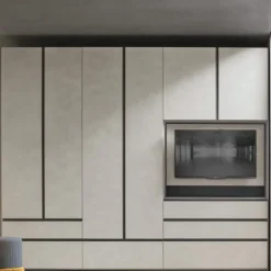 Armadio modulare componibile con vano TV girevole ante battenti e cassetti con maniglia a gola integrata tutta altezza disponibile in vari colori