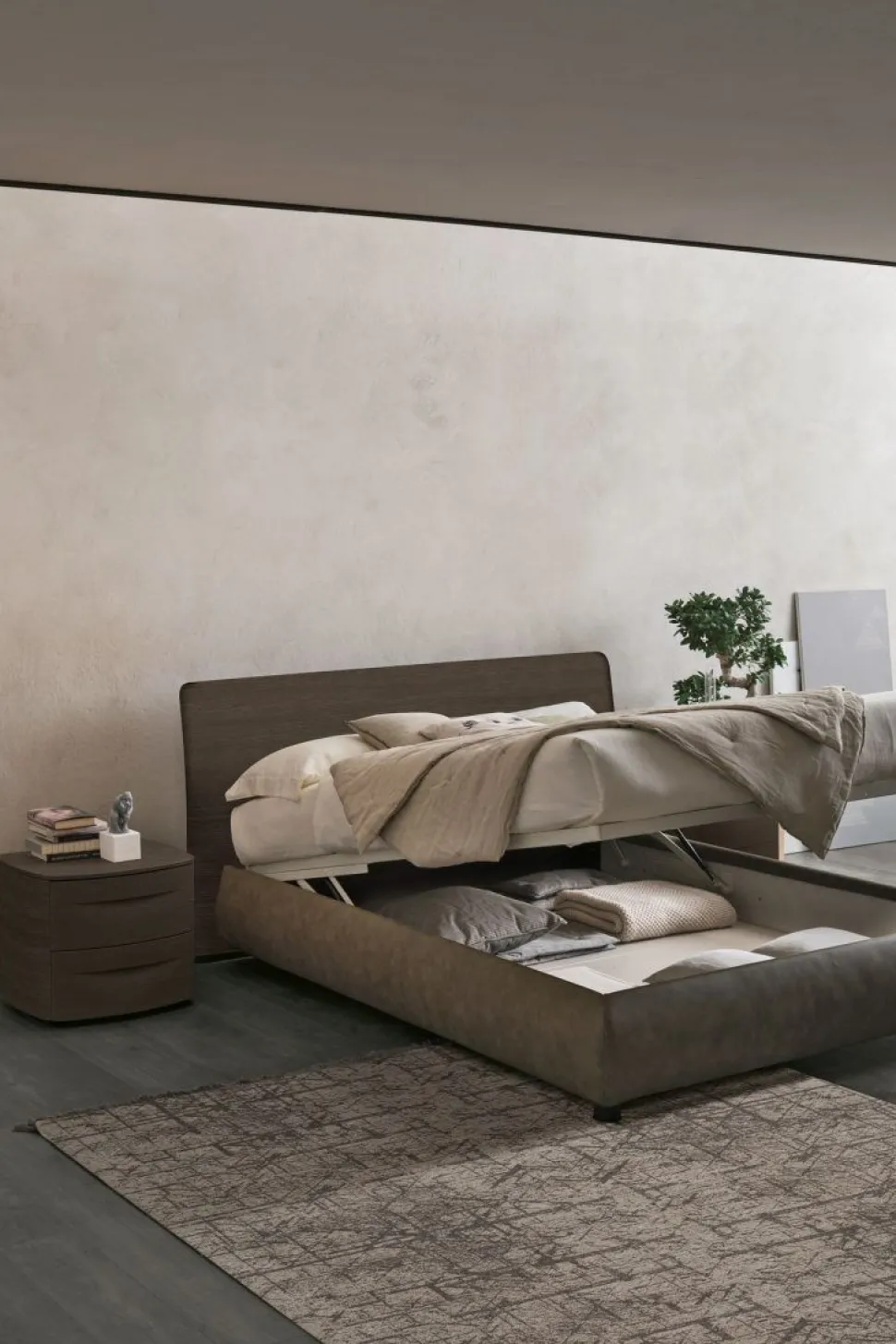 Letto contenitore con testiera curva e giroletto imbottito matrimoniale Ronald disponibile in 2 misure e vari colori