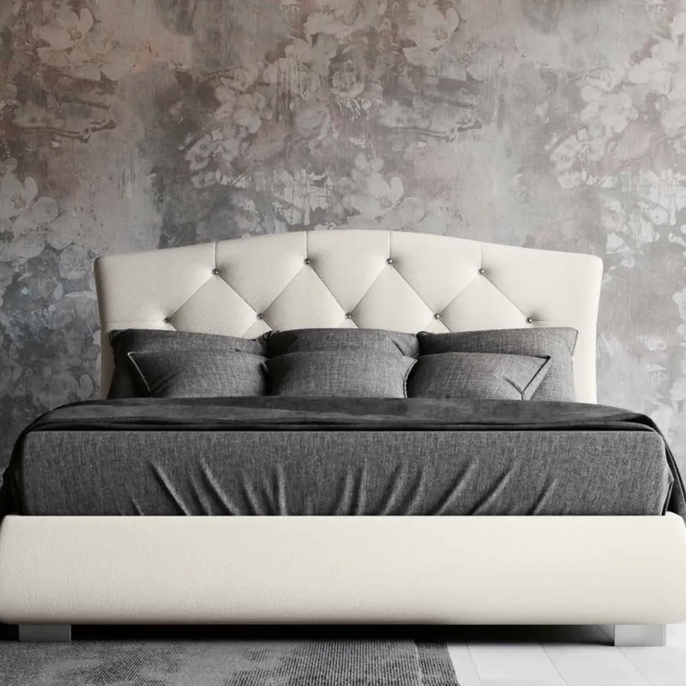 Letto matrimoniale imbottito in tessuto con testiera trapuntata disponibile in vari colori