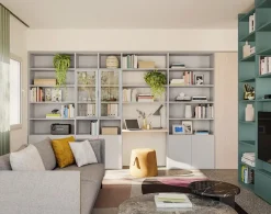 Libreria modulare con scrivania integrata e ante in vetro disponibile in vari colori