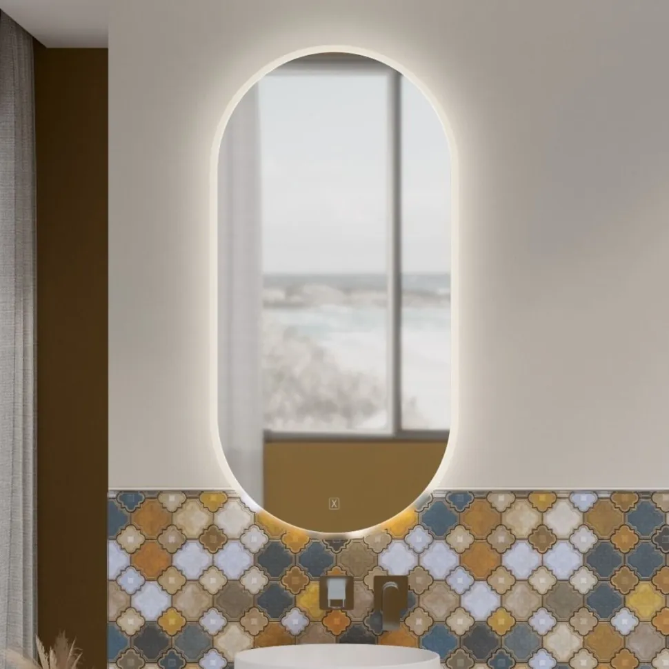 Specchio ovale reversibile con sabbiatura perimetrale retroilluminata