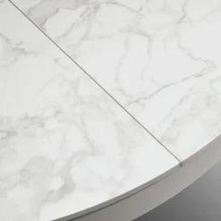 Tavolo rotondo allungabile con struttura in metallo e piano opaco in ceramica Abbraccio